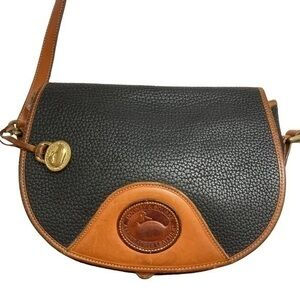 Dooney and Bourke black & brown all weather leather vintage crossbody saddle bag